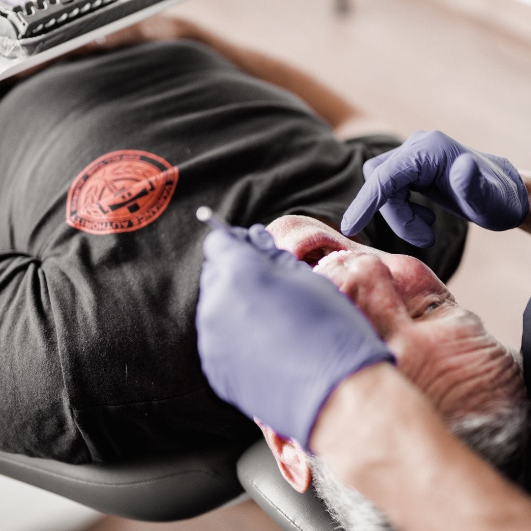 Feature Image - What is Dental Restoration - Dr checking Px teeth